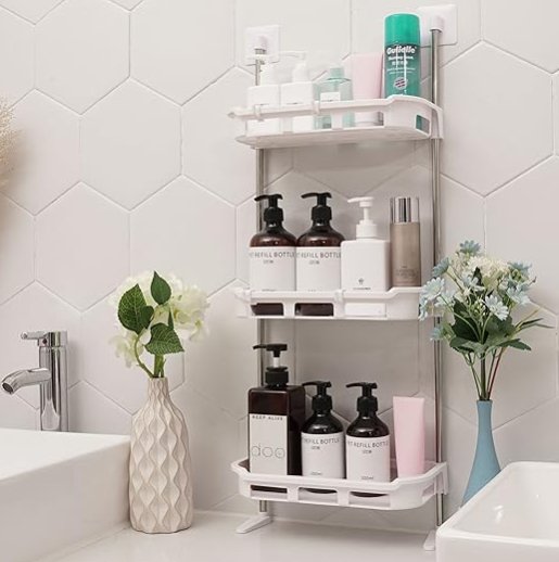 Hanging storage rack featuring three tiers for organizing bathroom essentials, with shampoo and skincare products.