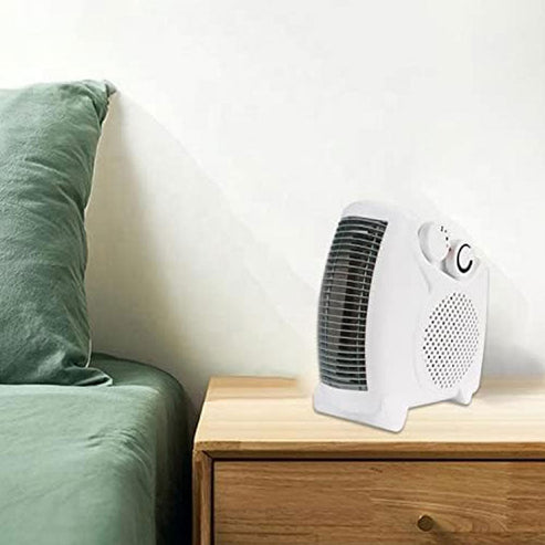 Portable fan heater on a bedside table, perfect for keeping warm in any room.